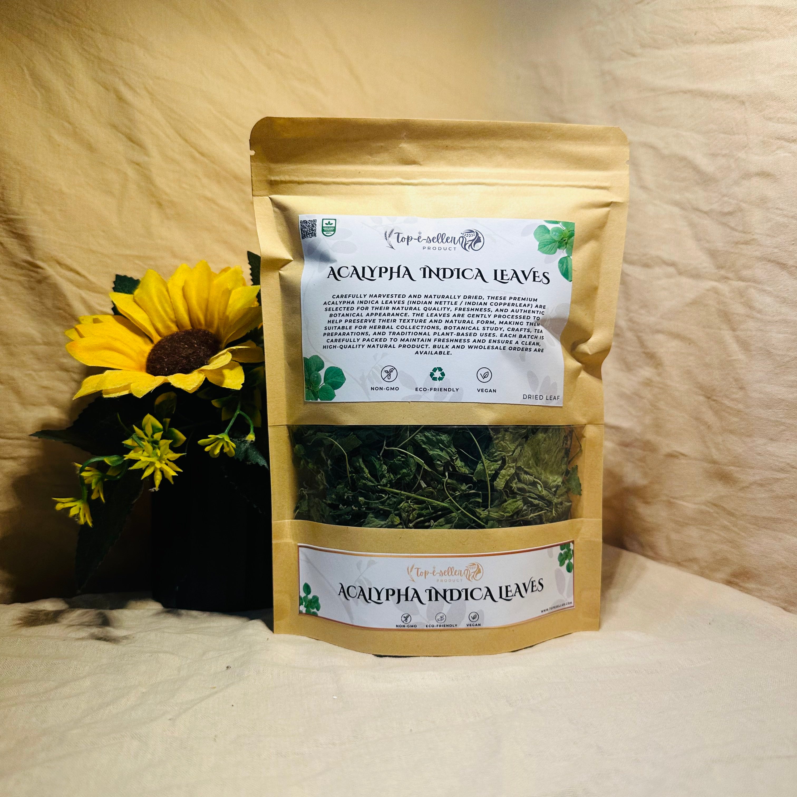 Two packages of Acalypha Indica Leaves with a sunflower on a textured surface