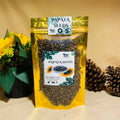Two packages of papaya seeds with a decorative background including flowers and pine cones.